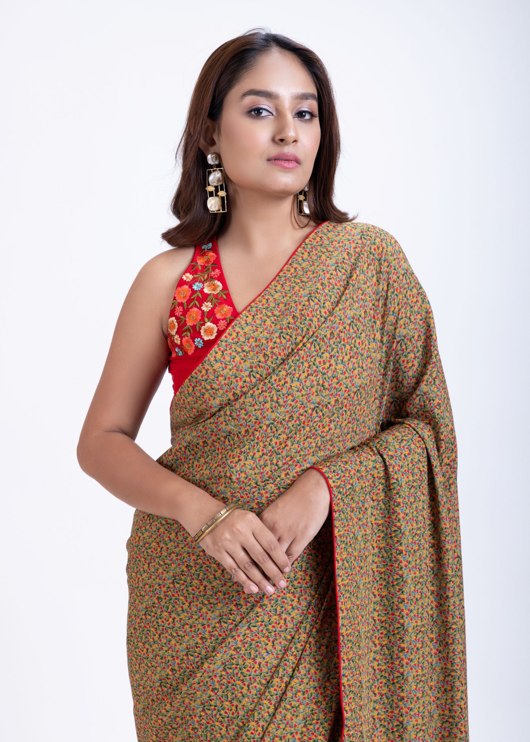 Olive Green Floral Printed Saree Set with Red Embroidered Sleeveless Blouse Front
