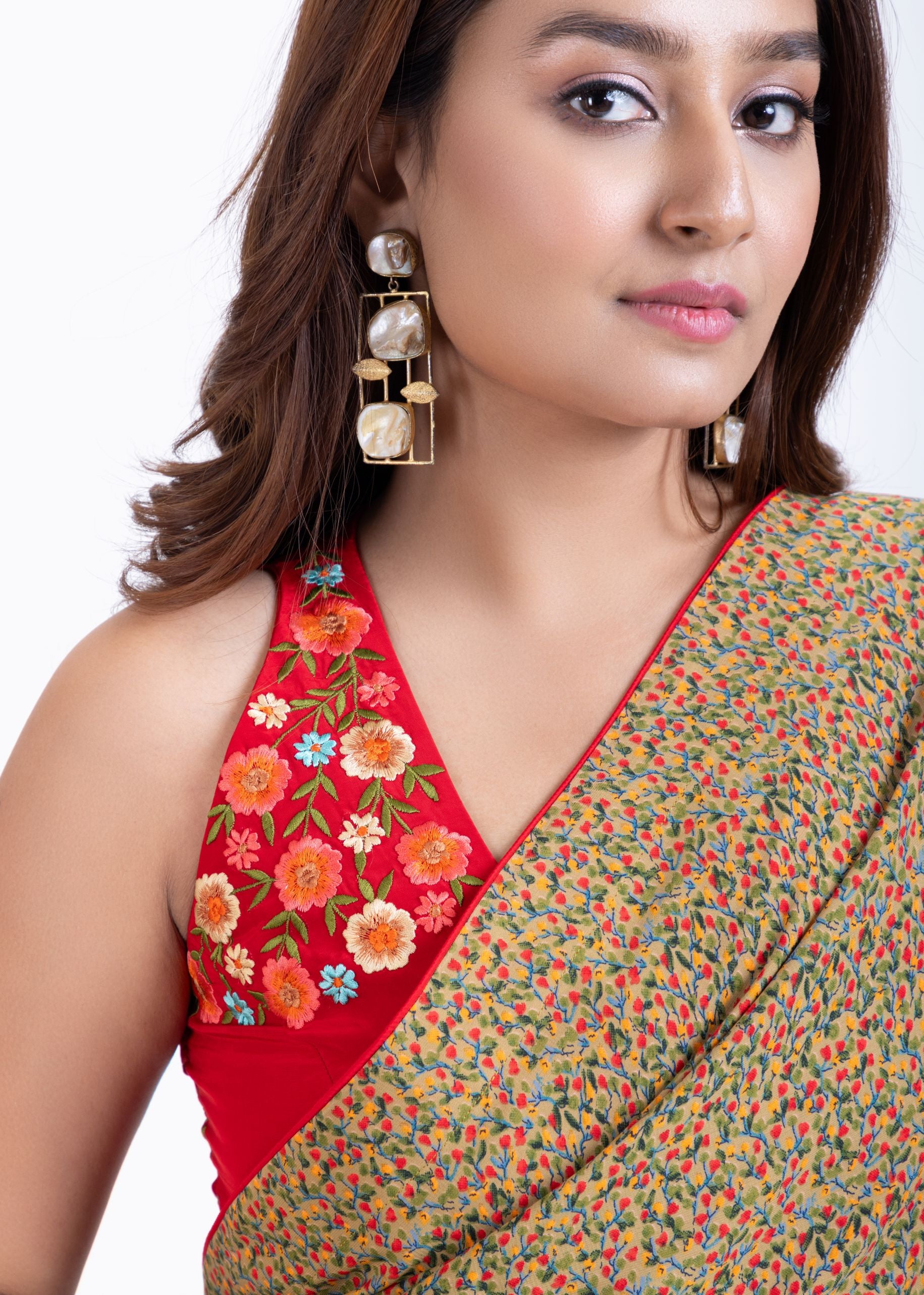 Olive Green Floral Printed Saree Set with Red Embroidered Sleeveless Blouse Close Up
