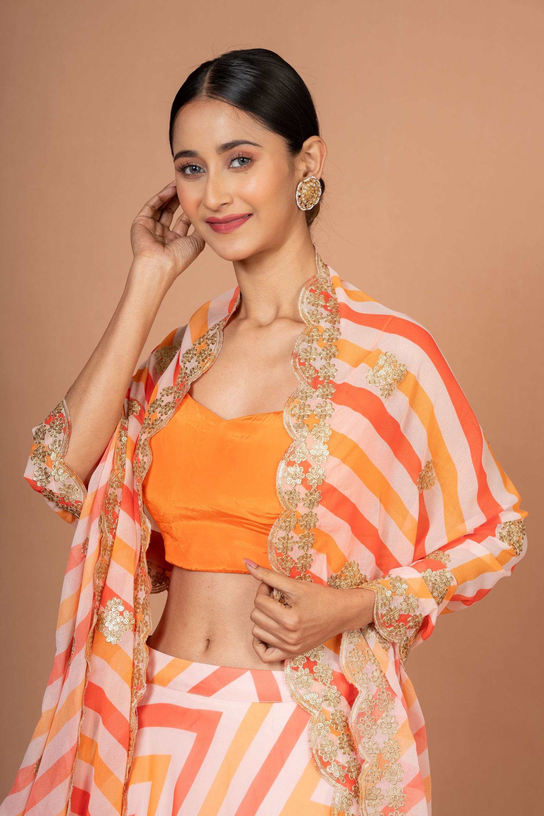 Orange Lehenriya Embroidered Georgette Lehenga Close Up
