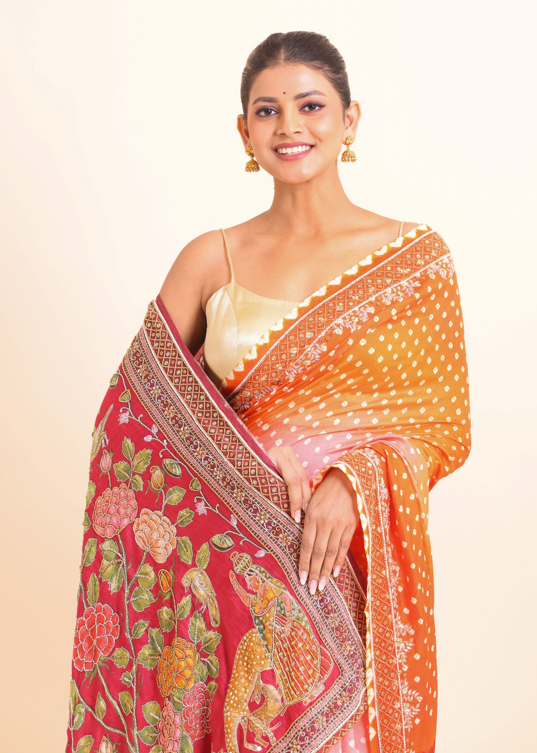 Orange and Red Bandhani Saree with Kalamkari Pallu with Hand Embroidered Work close up