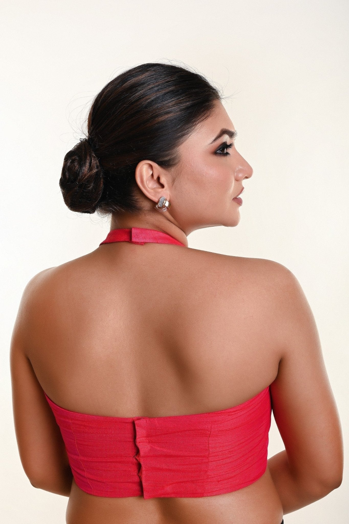 Pink cotton silk halter neck blouse with deep plunging neckline — back view