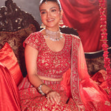 Red Bridal Lehenga Set sitting