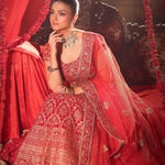 Red Bridal Lehenga Set sitting 2