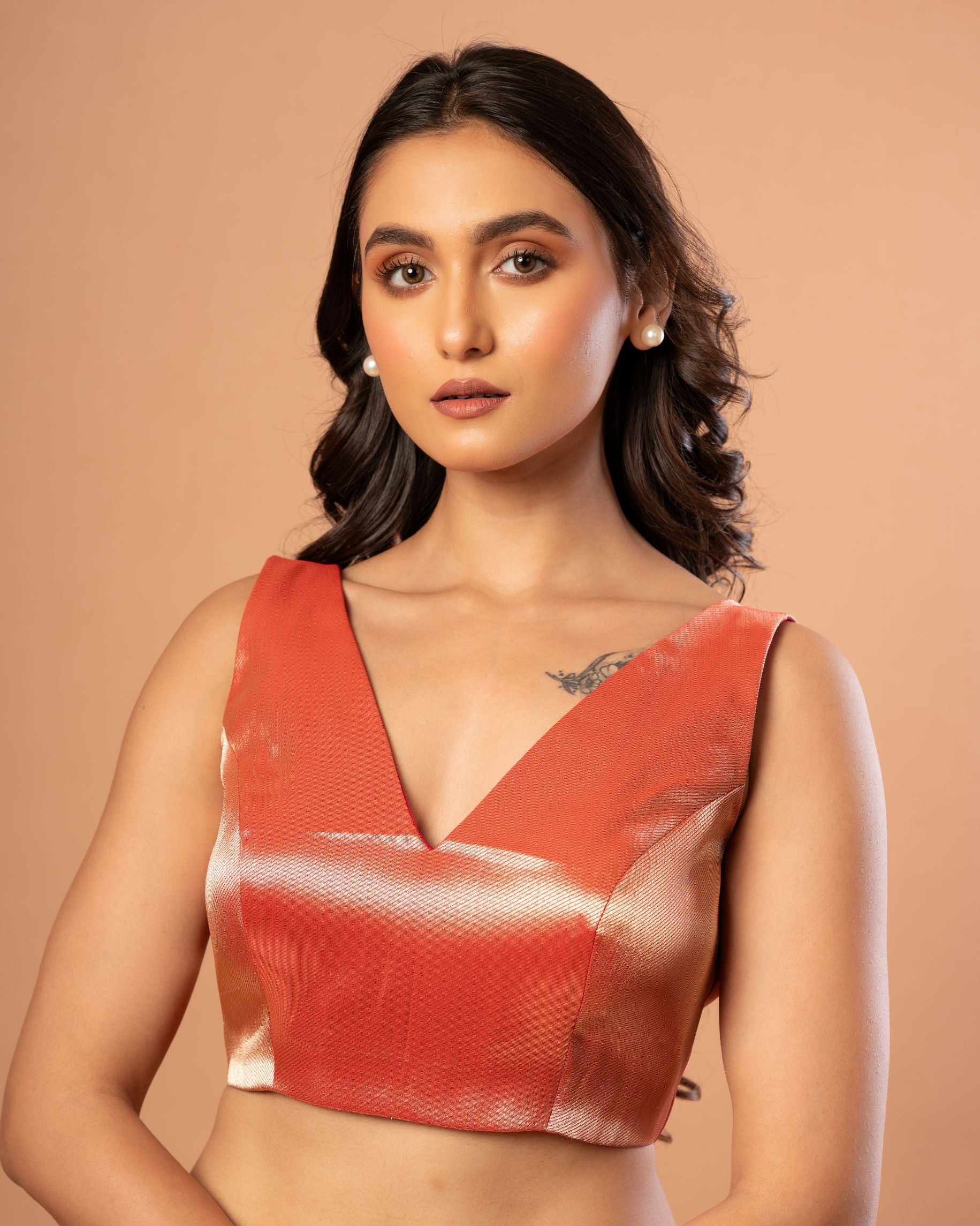 Red Silk Sleeveless Blouse with V Neckline
