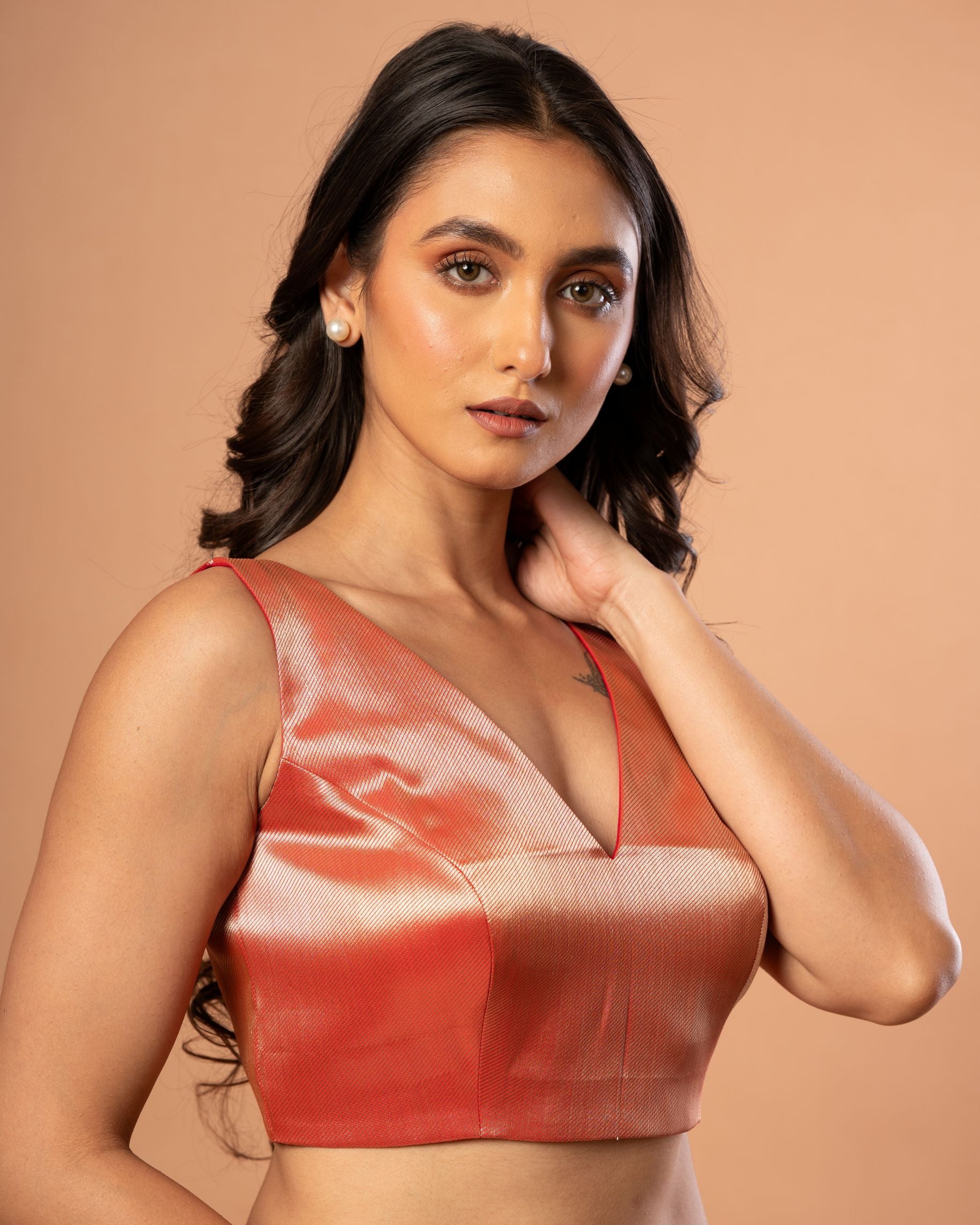 Red Brocade Sleeveless Blouse with V Neckline
