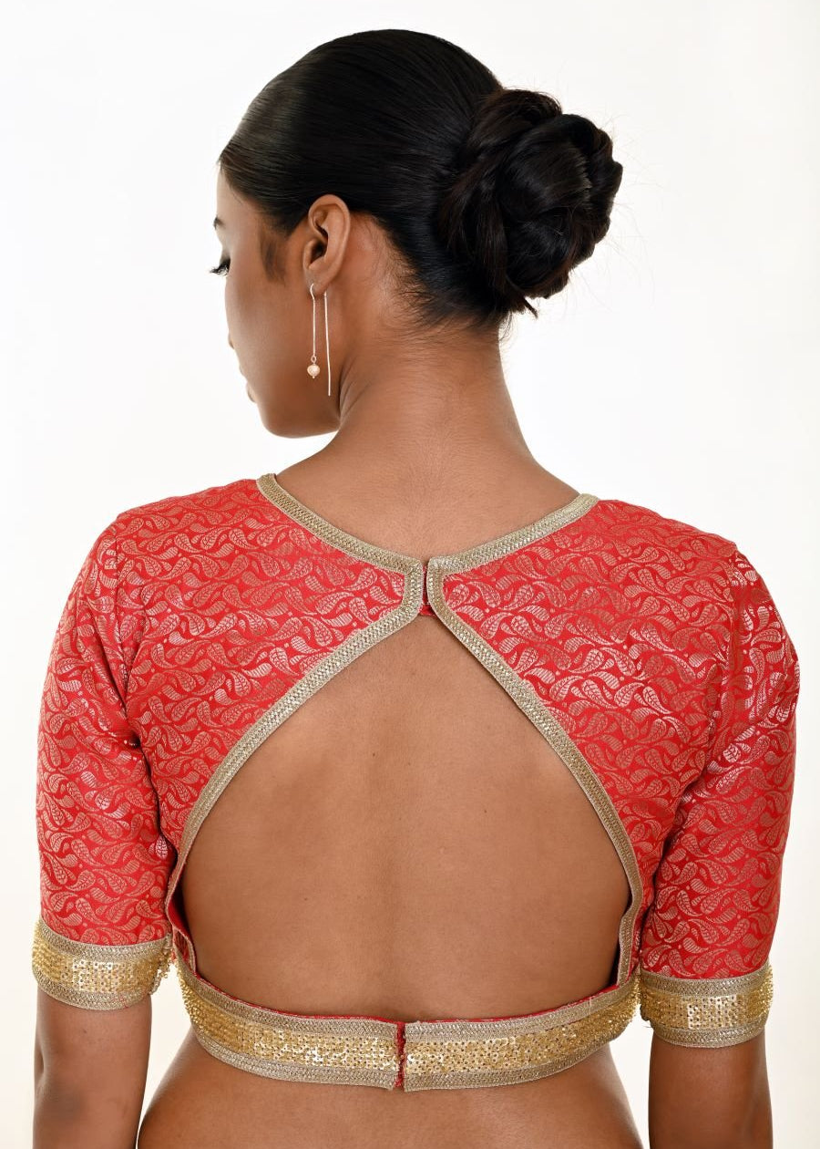 Red brocade blouse — back view showing gold embroidered back hem detail