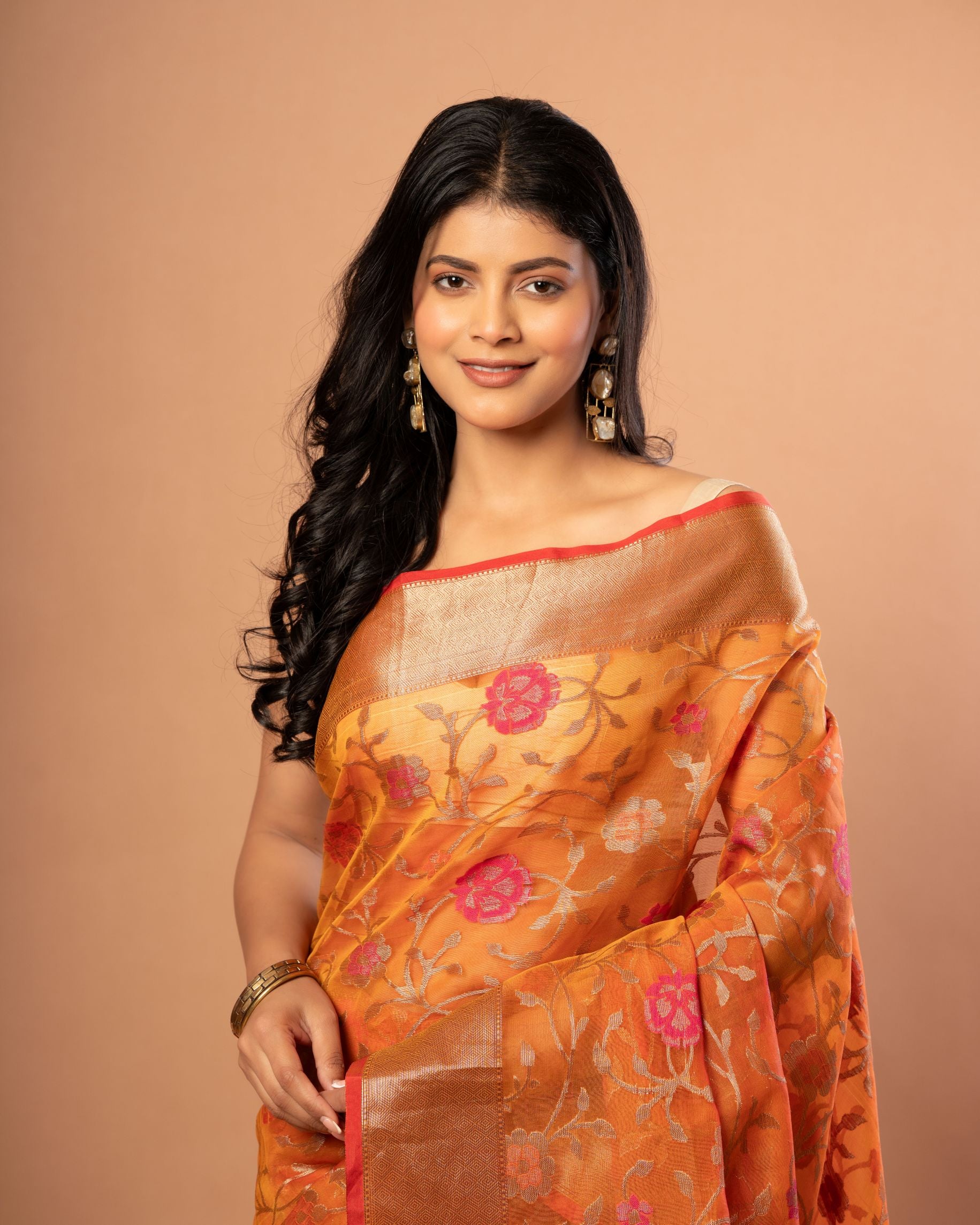 Rust Orange Tissue Organza Saree With Floral Weaved- Anvi Couture
