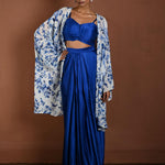 Blue Draped Skirt Set with Matching Blouse and White Cape Jacket - Anvi Couture