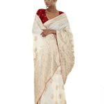 Pearl White and Gold Dola Silk Embroidered Saree with Stone Embellishment and Red Piping Border - Anvi Couture