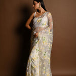 White Net Saree with Multicolored Floral Embroidery and Cutdana Border - Anvi Couture