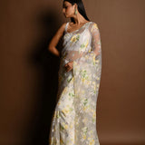 White Net Saree with Multicolored Floral Embroidery and Cutdana Border - Anvi Couture