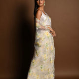 White Net Saree with Multicolored Floral Embroidery and Cutdana Border - Anvi Couture