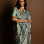 Sage Green Satin Silk Saree with Floral Prints and Parsi Gara Border - Anvi Couture