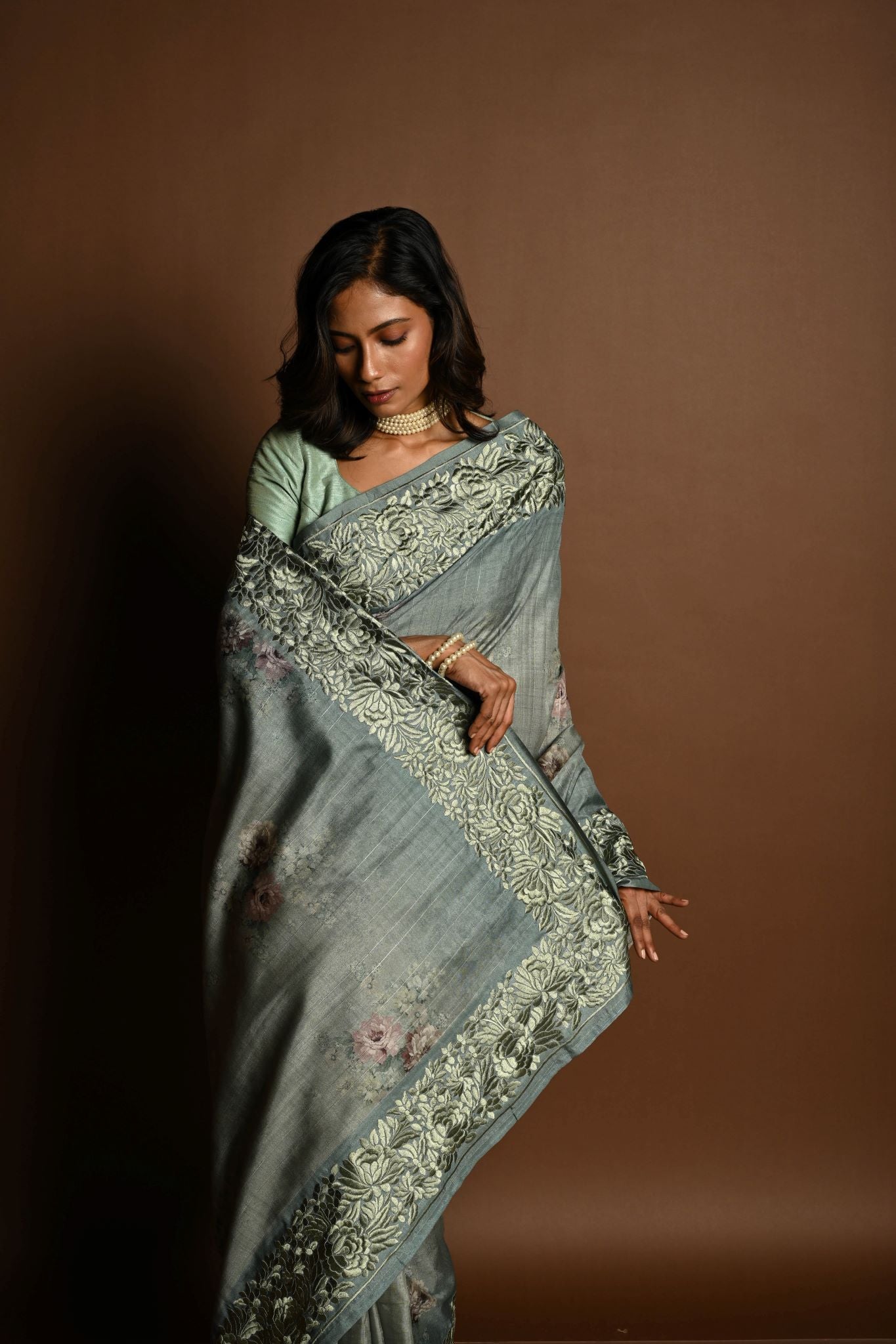 Sage Green Satin Silk Saree with Floral Prints and Parsi Gara Border - Anvi Couture