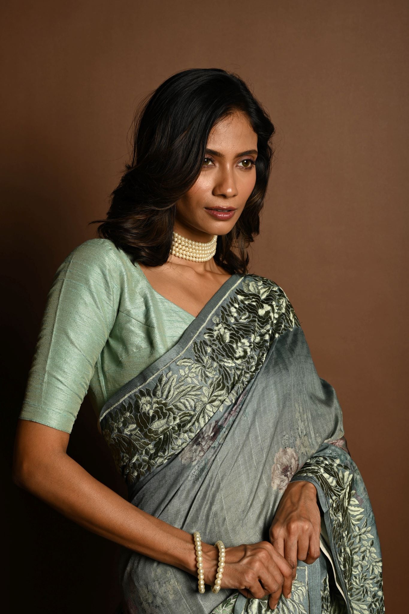 Sage Green Satin Silk Saree with Floral Prints and Parsi Gara Border - Anvi Couture