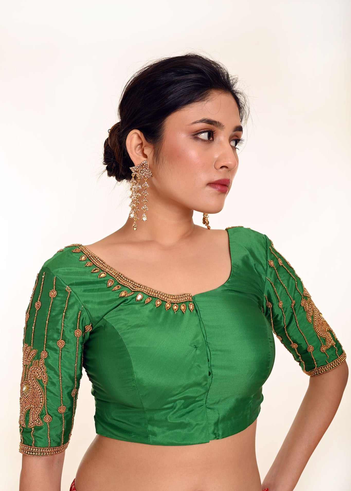 A Woman Wearing an Aari Work Blouse in Green Color made from Pure Silk - Bridal Blouse, Festive Blouse - Anvi Couture: Image 3