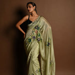 Olive Green Crepe Silk Saree with Floral Prints and Embroidered stonework and Cutdana Border - Anvi Couture