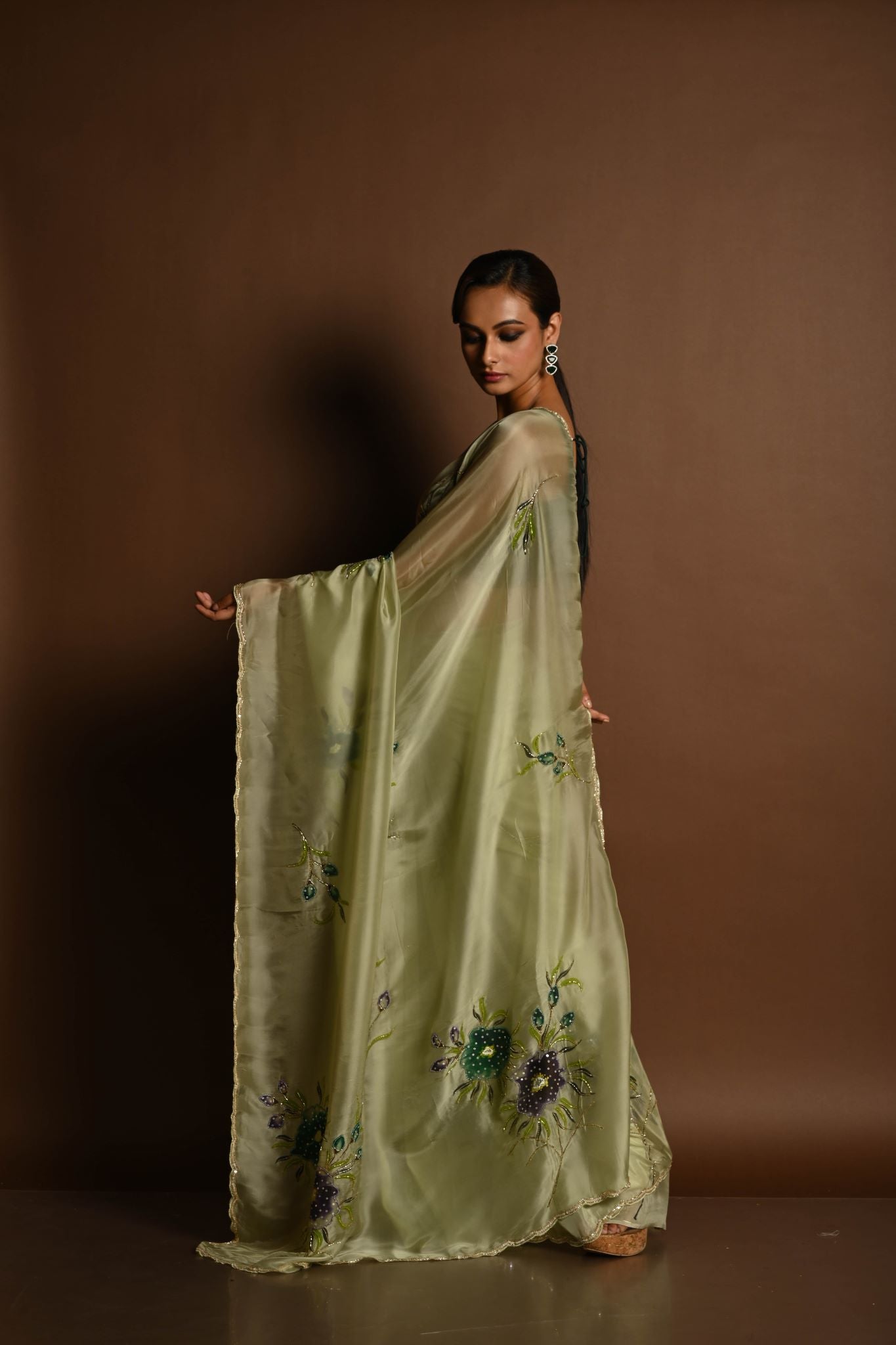 Olive Green Crepe Silk Saree with Floral Prints and Embroidered stonework and Cutdana Border - Anvi Couture