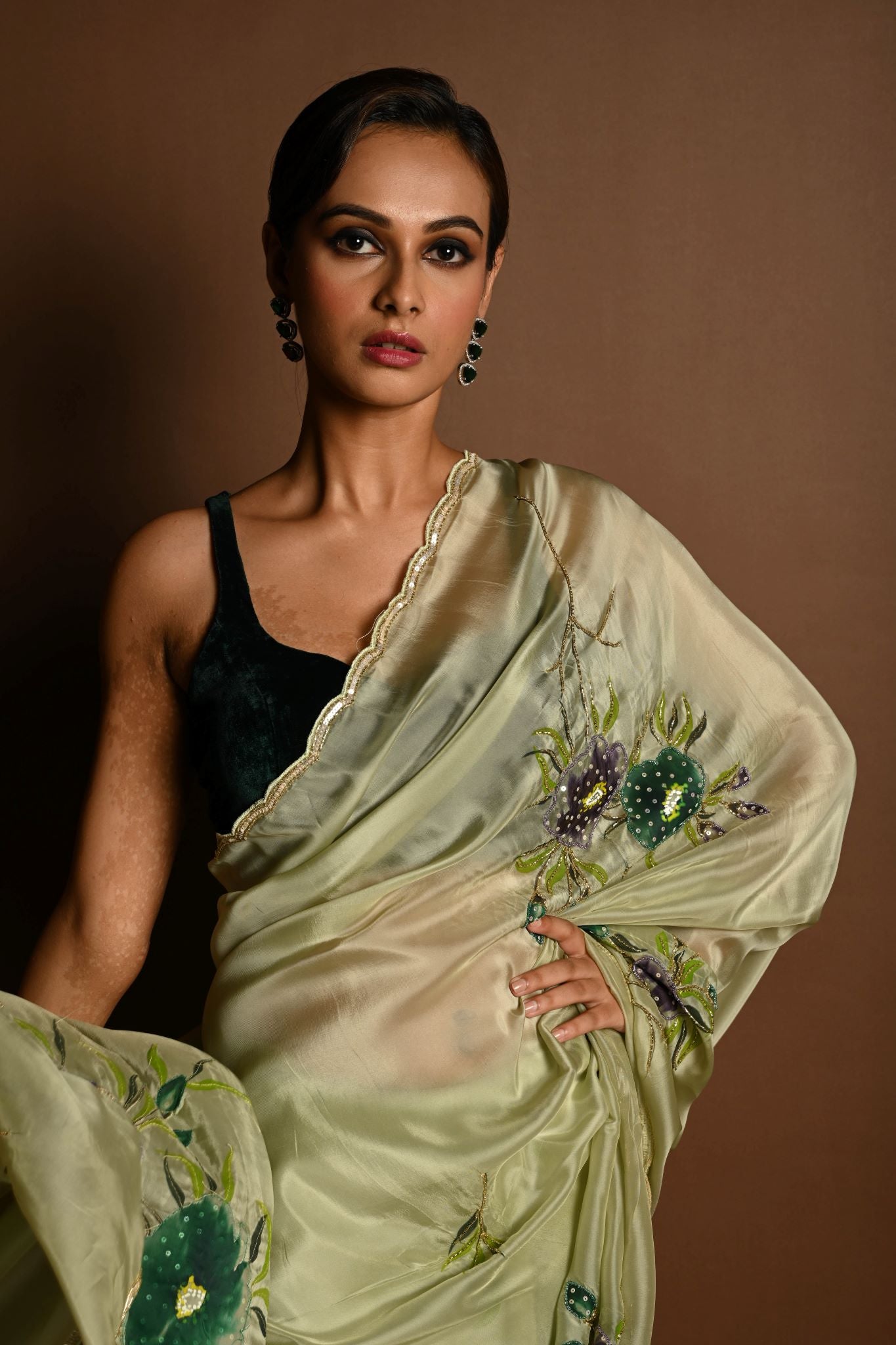 Olive Green Crepe Silk Saree with Floral Prints and Embroidered stonework and Cutdana Border - Anvi Couture