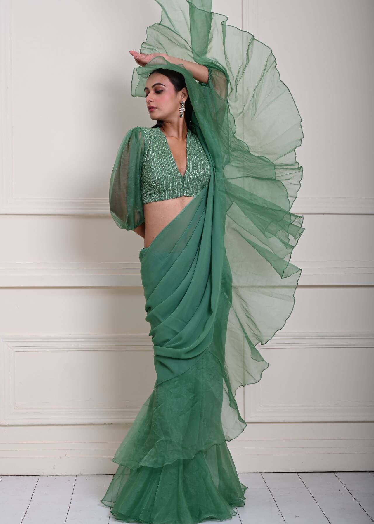 Elegant Ruffle Detailing on Sea Green Saree