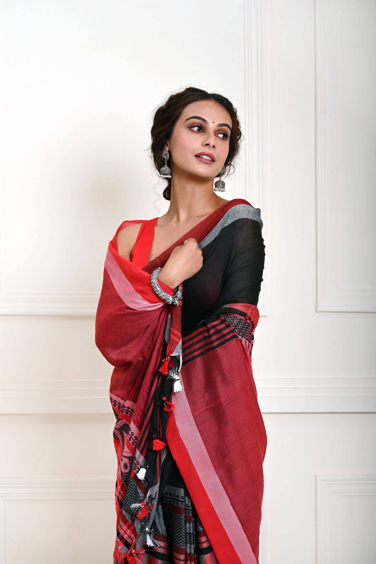 Black Handloom Saree with Red Border and Fish Motifs  