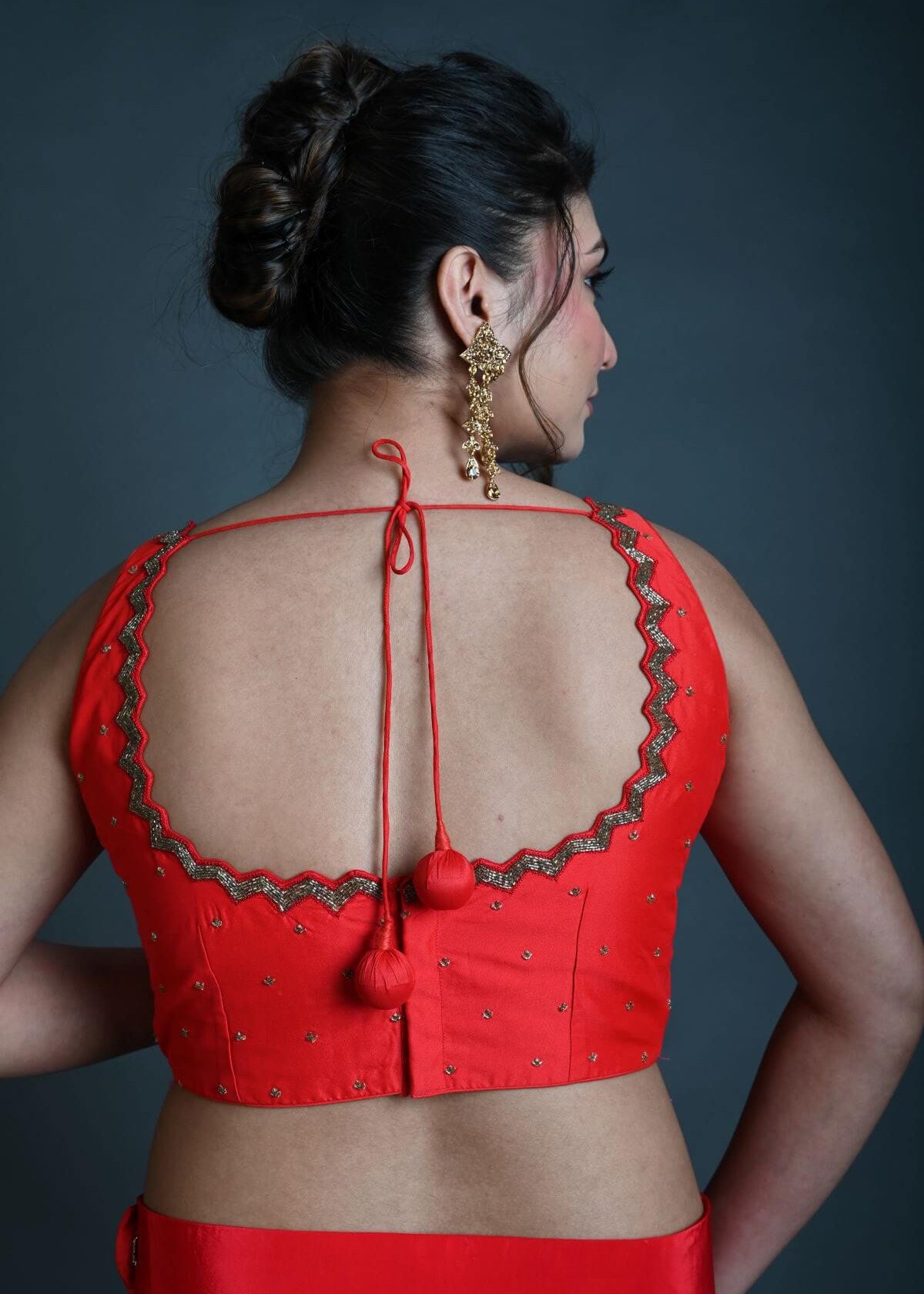 Red Sleeveless Blouse in Raw Silk with Cutdana Embroidery - Anvi Couture