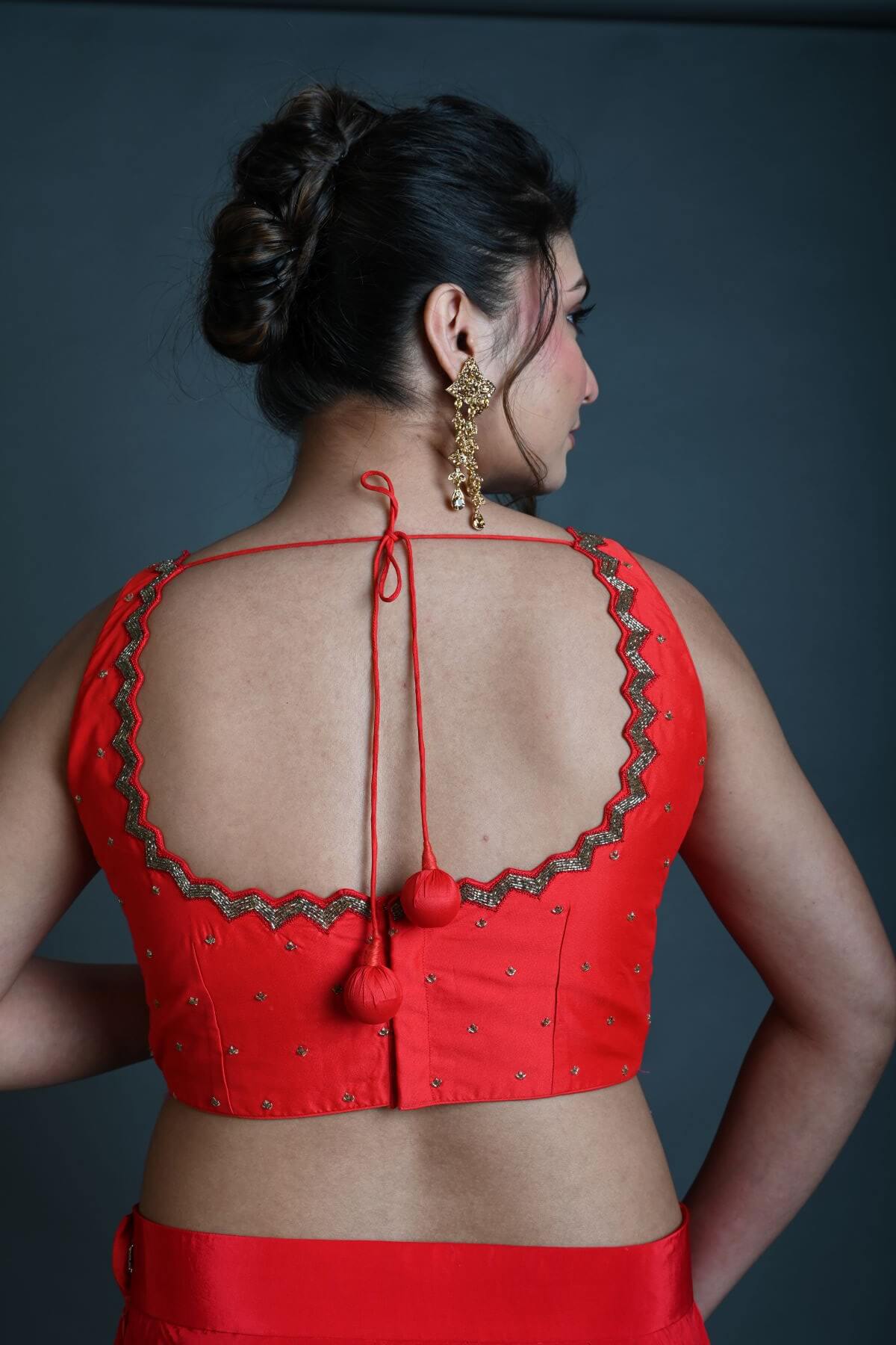 Red Sleeveless Blouse in Raw Silk with Cutdana Embroidery - Anvi Couture