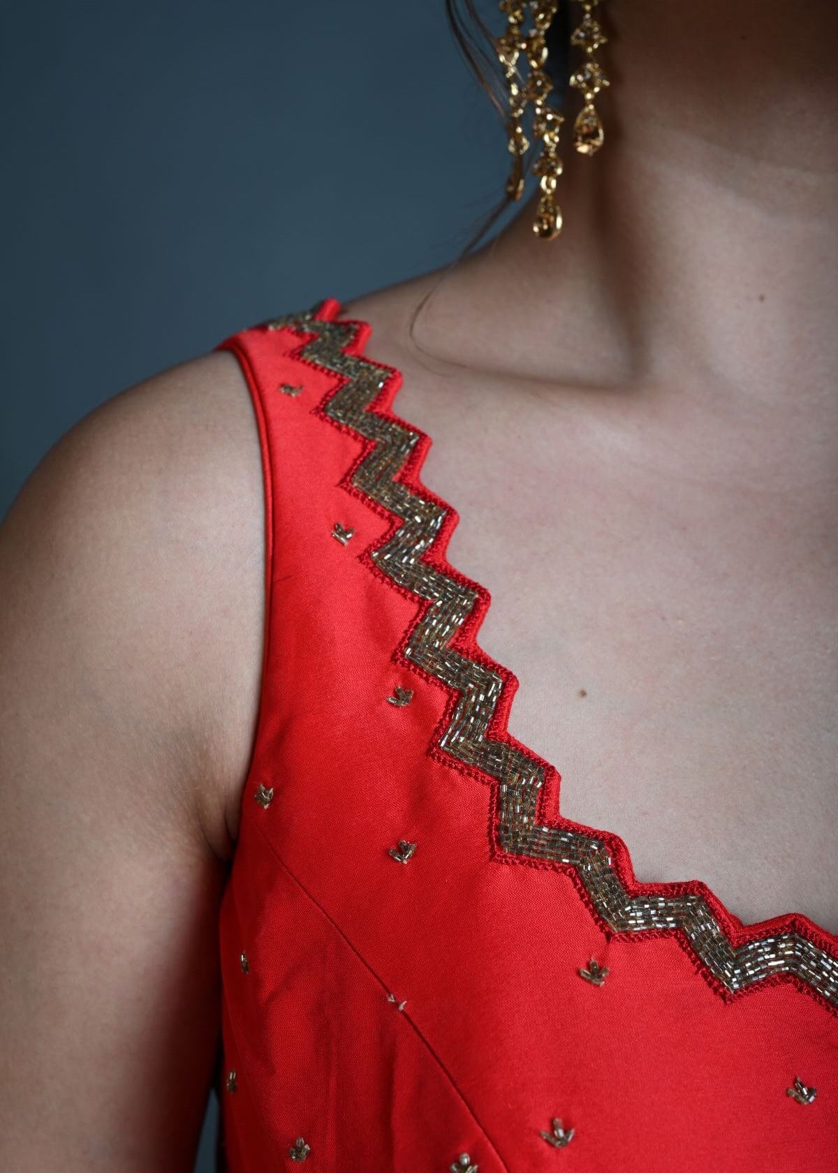 Red Sleeveless Blouse in Raw Silk with Cutdana Embroidery - Anvi Couture