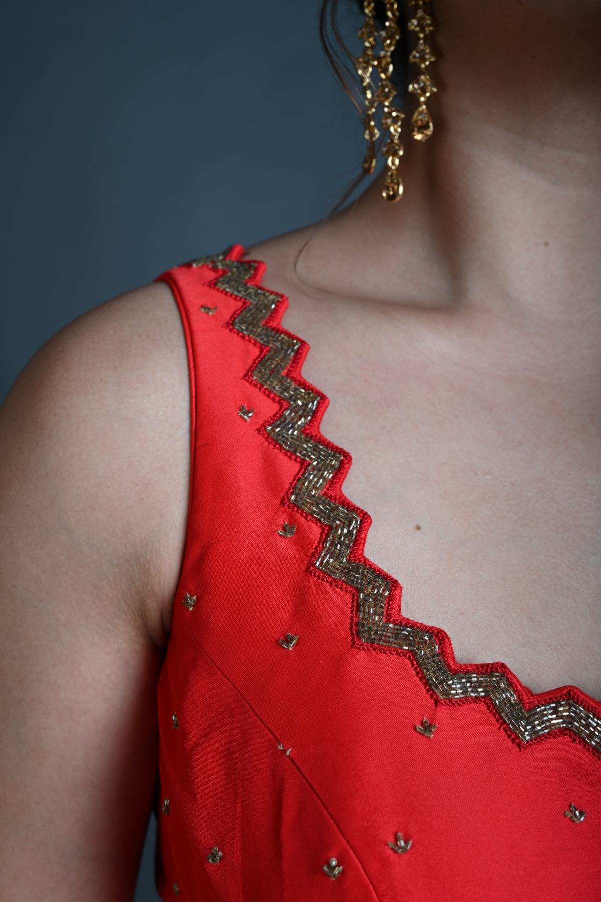 Red Sleeveless Blouse in Raw Silk with Cutdana Embroidery - Anvi Couture