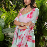 Sea green georgette saree with pink floral prints — full-length side view