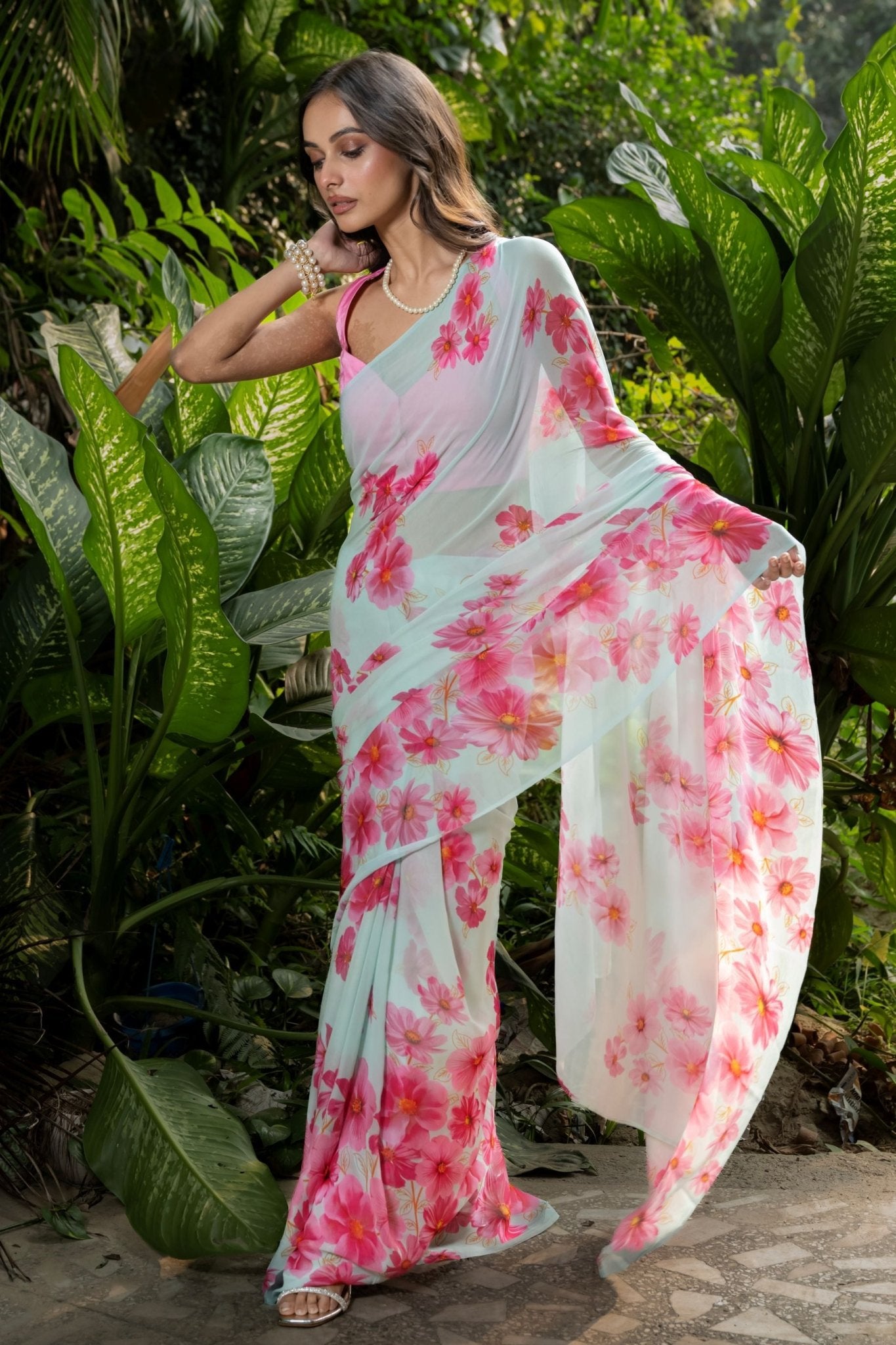 Sea green georgette saree with pink floral prints — pallu drape detail