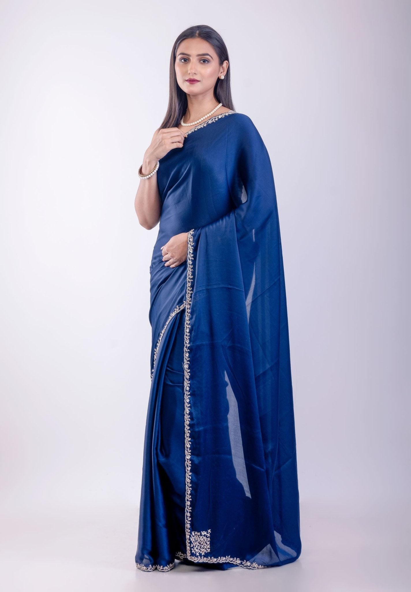 Side profile of blue crepe silk saree showing embroidered border detail — Anvi Couture