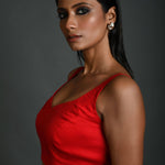 Side profile of red sleeveless cotton blouse with lightweight fabric design