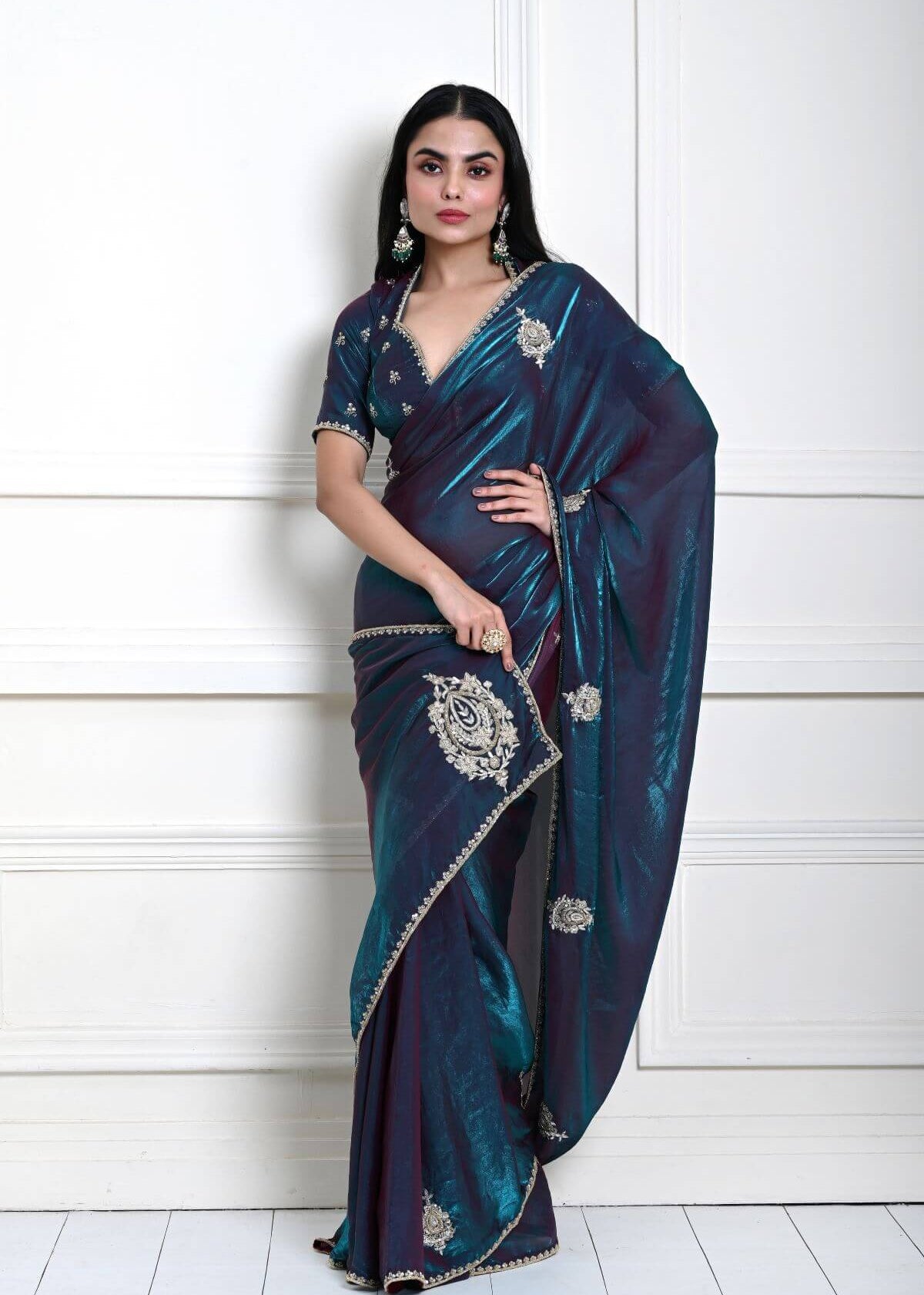 Teal blue organza silk saree with all-over hand embroidery — full drape front view