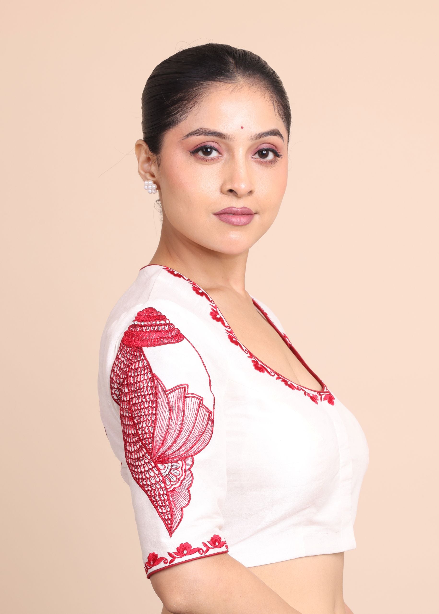 While Raw Silk Blouse With Red Shakha Hand Embroidery work close up