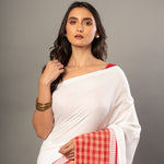 White Cotton Saree With Red Gamcha Patchworks in Border and Pallu - Anvi Couture
