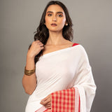 White Cotton Saree With Red Gamcha Patchworks in Border and Pallu - Anvi Couture