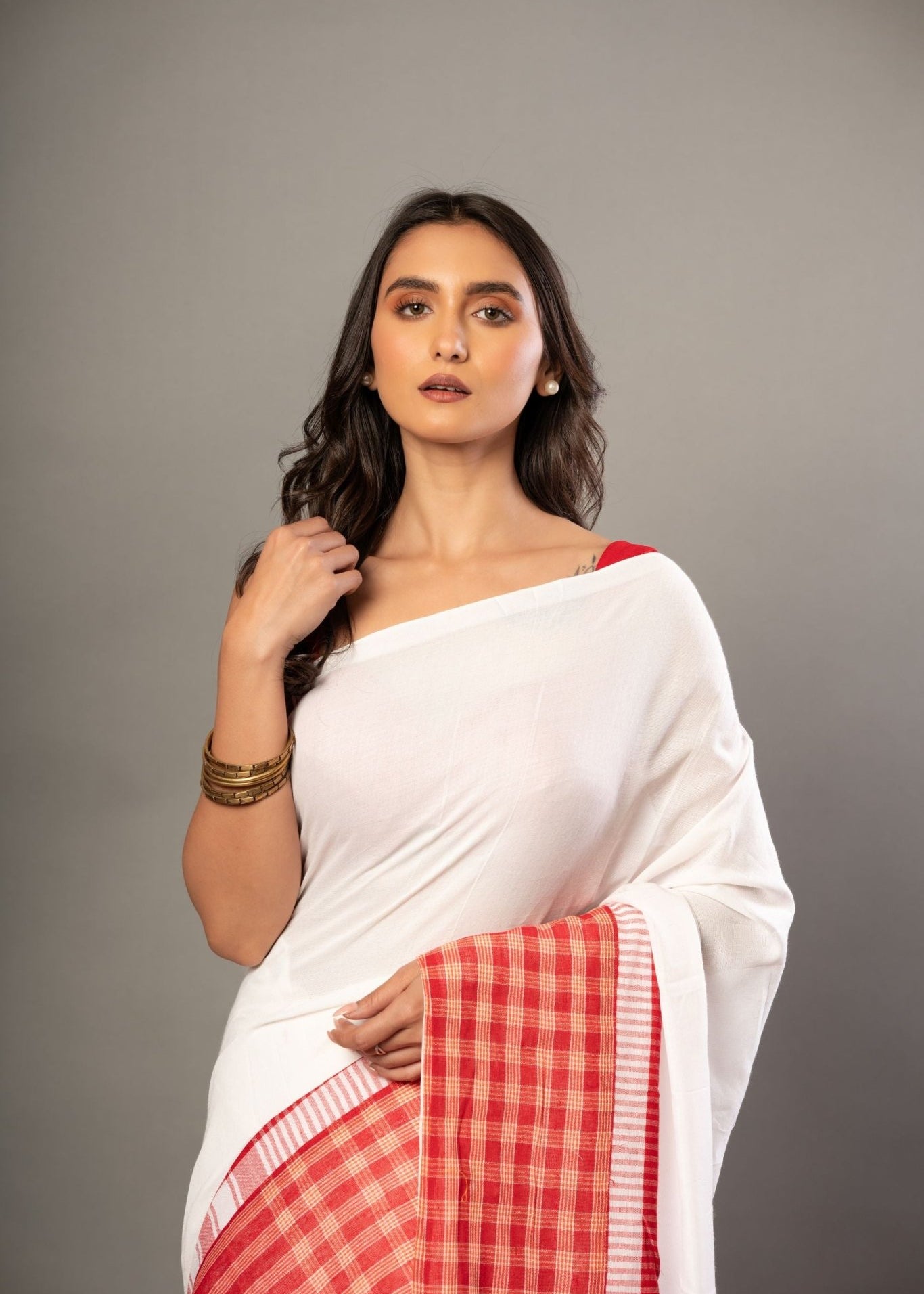 White Cotton Saree With Red Gamcha Patchworks in Border and Pallu - Anvi Couture
