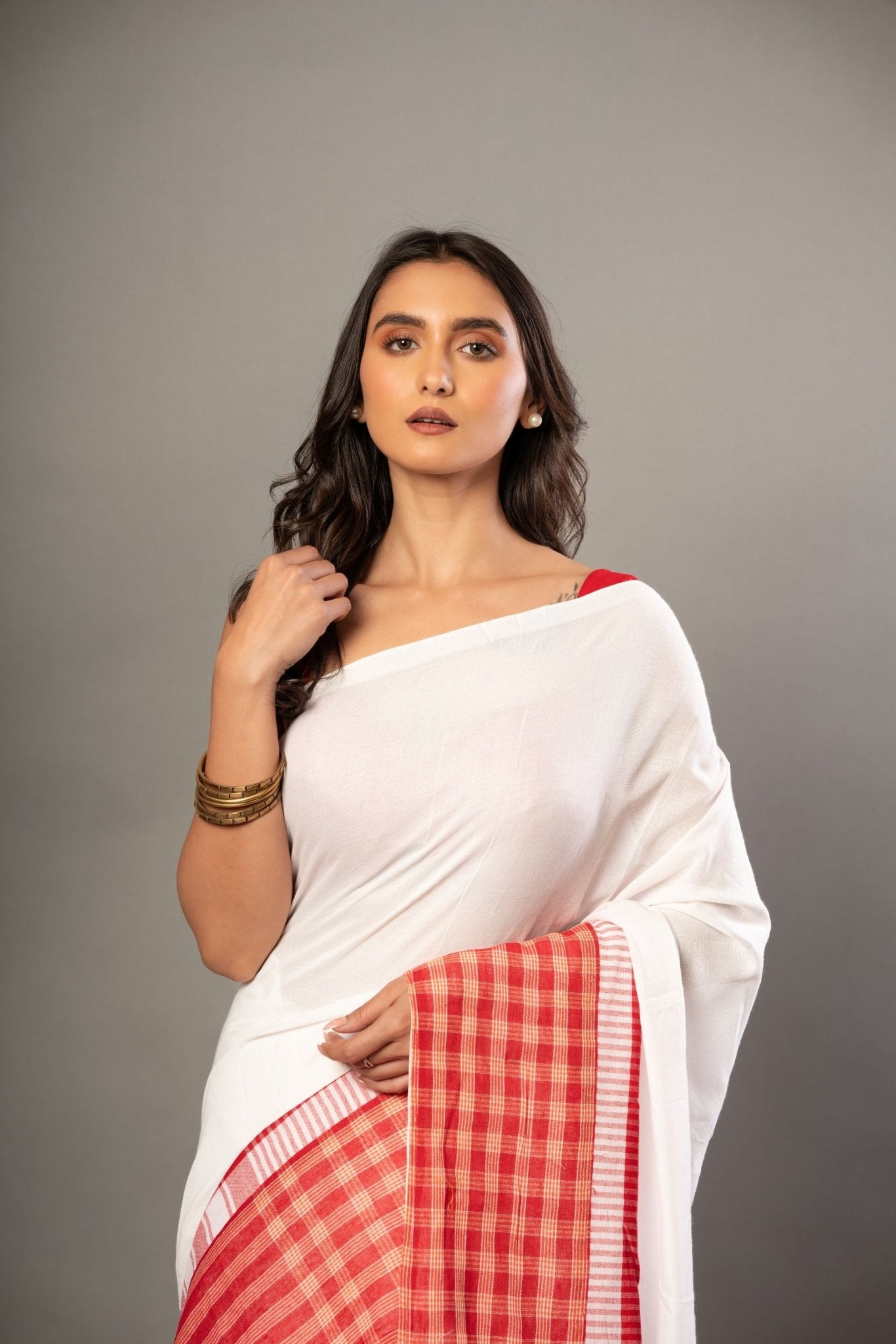 White Cotton Saree With Red Gamcha Patchworks in Border and Pallu - Anvi Couture