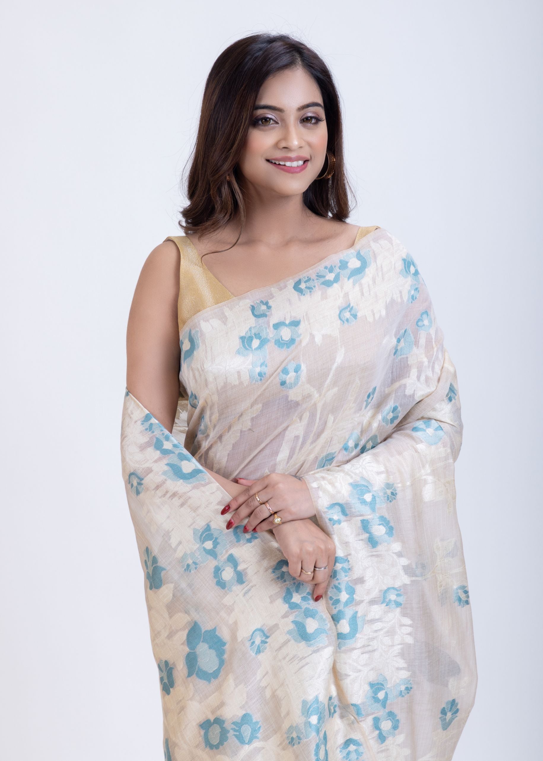 White Dhakai Jamdani Saree with Blue and White Floral Motifs Close Up
