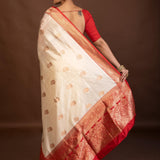 White Katan Silk Saree with Contrasting Red Border and Gold Zari Work - Anvi Couture