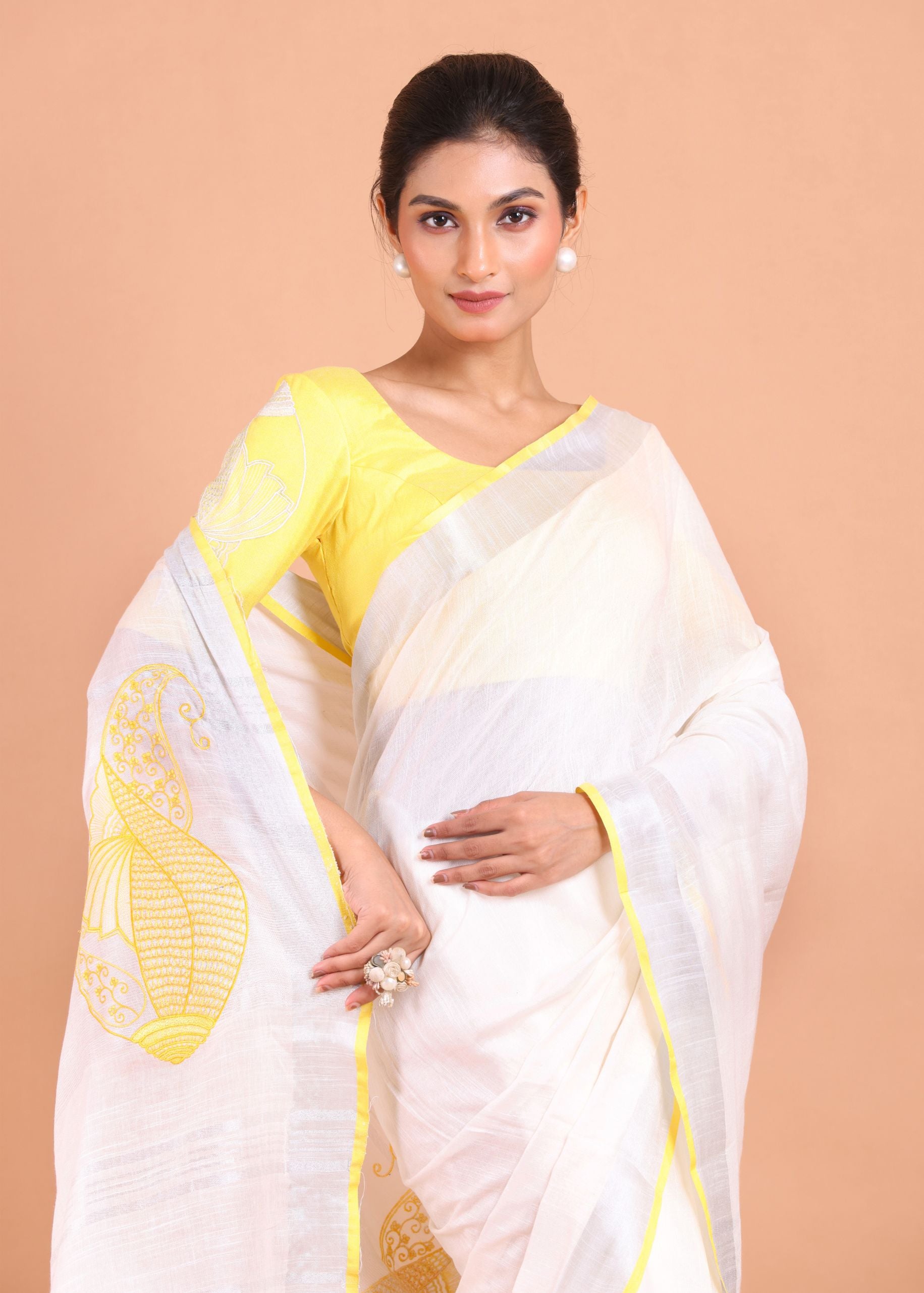 White Linen Saree with Yellow Border and Embroidery Work Close Up View