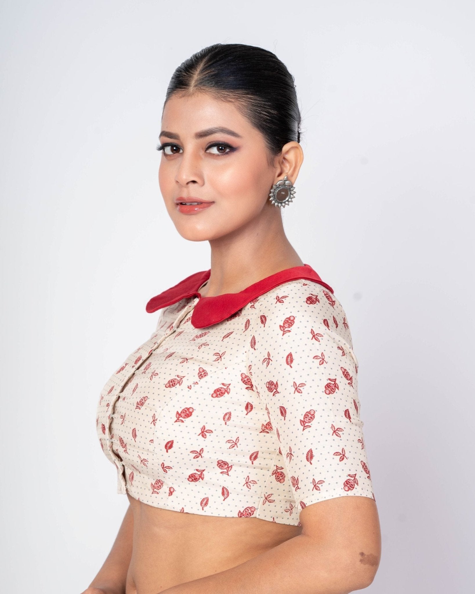 White floral printed maroon collar neck blouse with elbow sleeves for a modern saree look