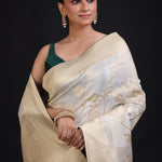 White and Gold Banarasi Saree with Green Piping finishing close up