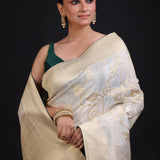 White and Gold Banarasi Saree with Green Piping finishing close up