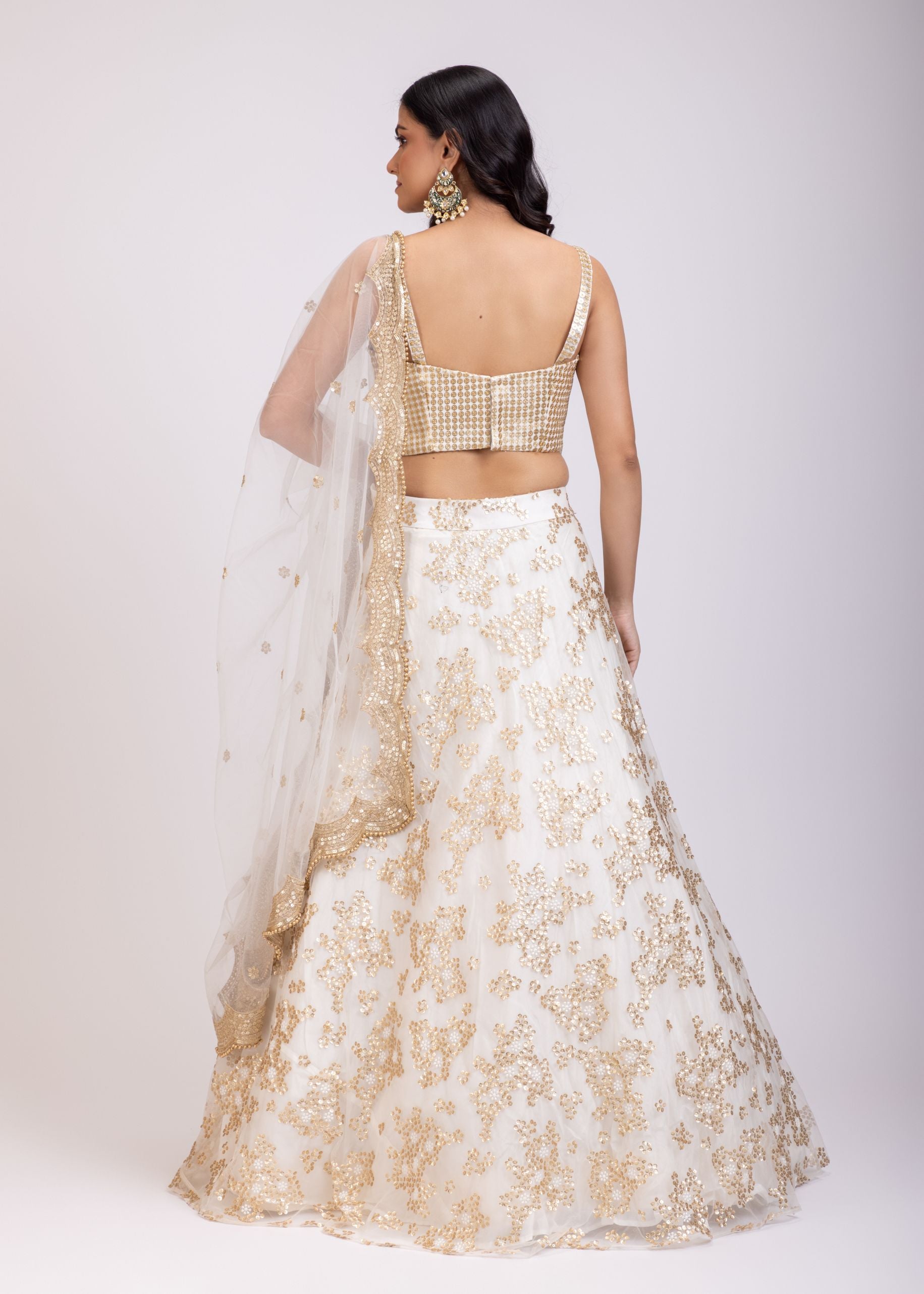 White and Golden Corset Lehenga Set With Sequin Embellished Work back
