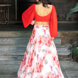 Soft bloom white and orange floral lehenga — back view of full flared skirt and dupatta drape