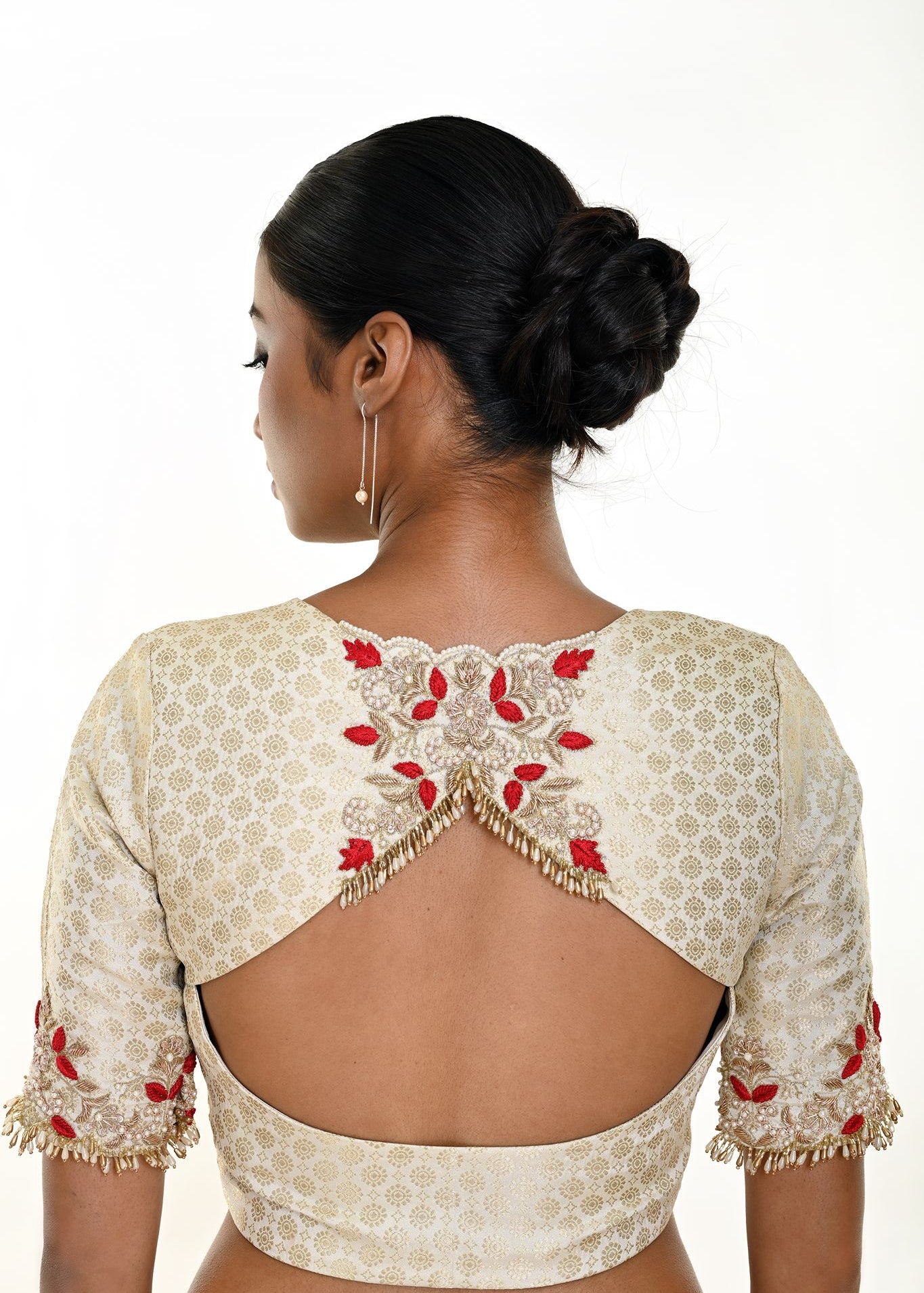 White brocade blouse — back view with elbow sleeves and embroidery