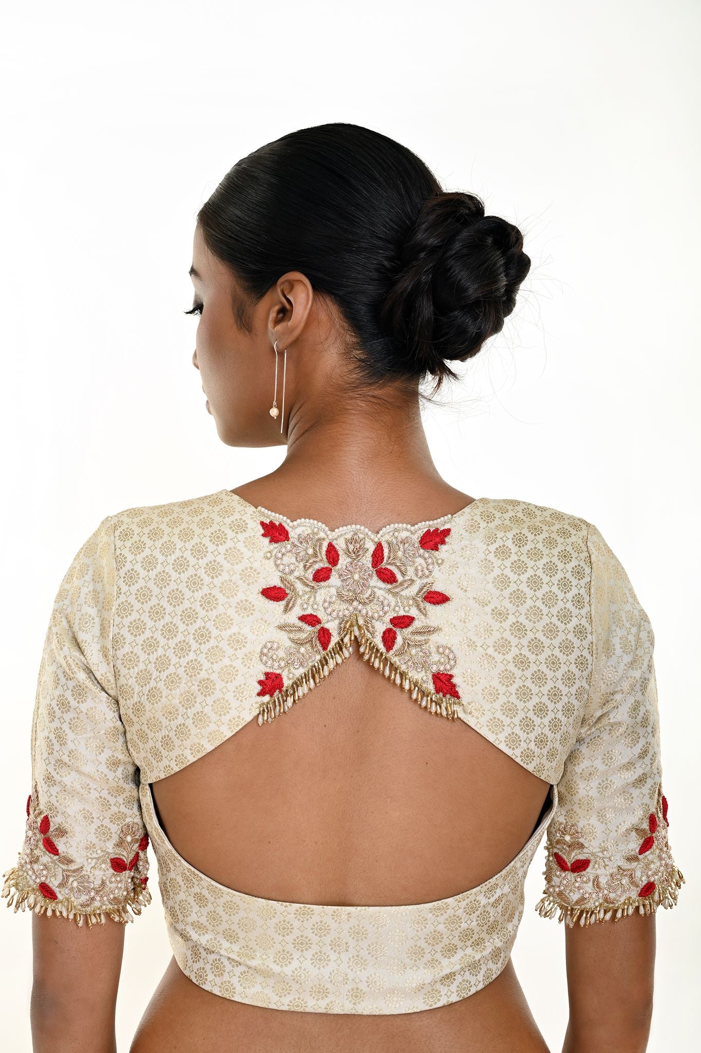 White brocade blouse — back view with elbow sleeves and embroidery