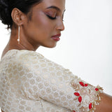 White brocade blouse — side profile showing Queen Anne neckline shape